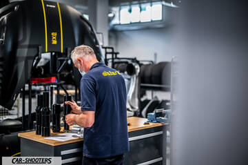 Dallara – detail, mechanic working in a workshop