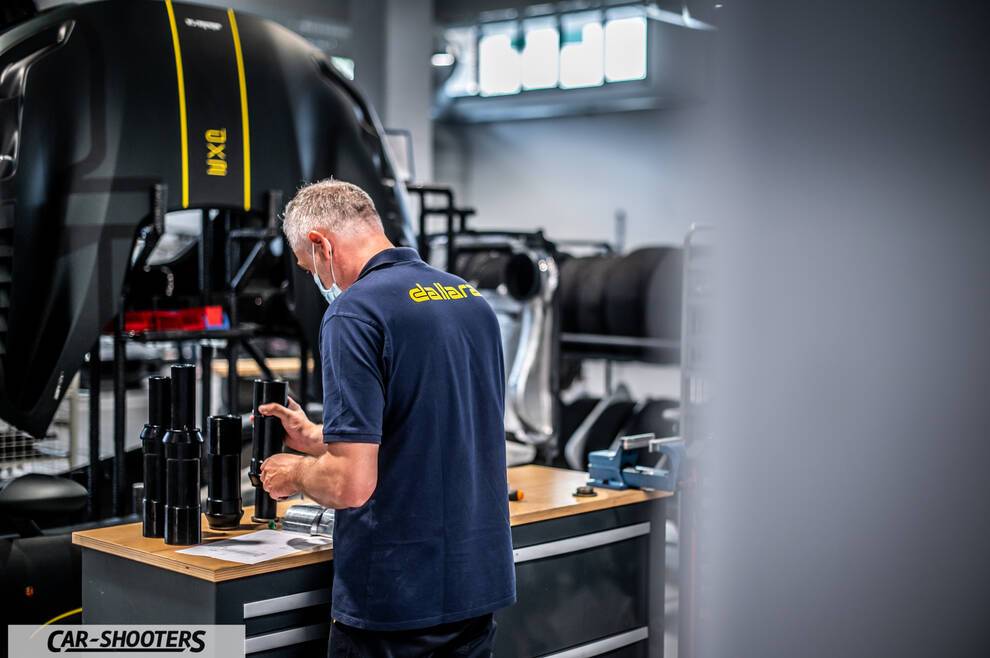 Dallara – detail, mechanic working in a workshop