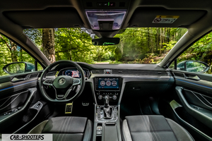 Volkswagen Passat Alltrack – dashboard, view through the windshield of a forest
