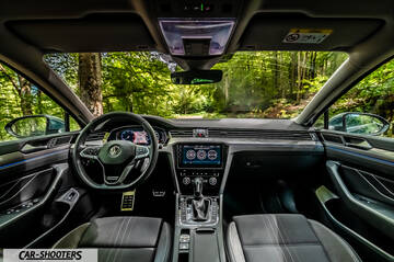 Volkswagen Passat Alltrack – dashboard, view through the windshield of a forest