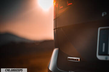 Volkswagen Passat Alltrack – rear view, dark grey against a sunset backdrop