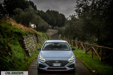 Hyundai i30N – front three-quarter, light blue on a country road