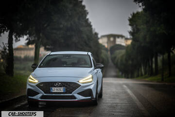Hyundai i30N – front three-quarter, light blue on a country road
