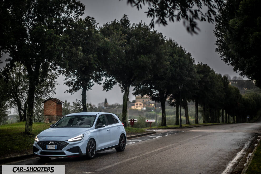 Hyundai i30N – front three-quarter, light blue on a country road