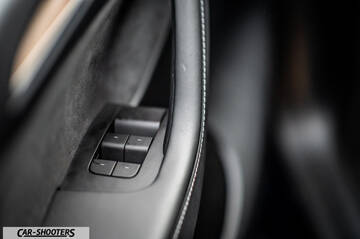 Tesla Model Y – detail, door panel controls close-up