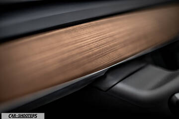 Tesla Model Y – detail, wooden dashboard trim close-up
