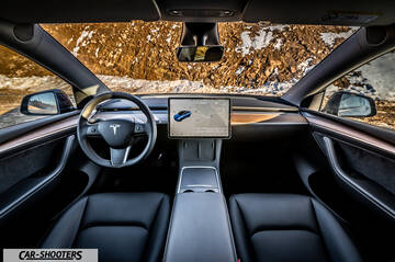 Tesla Model Y – dashboard, against a snowy mountain backdrop