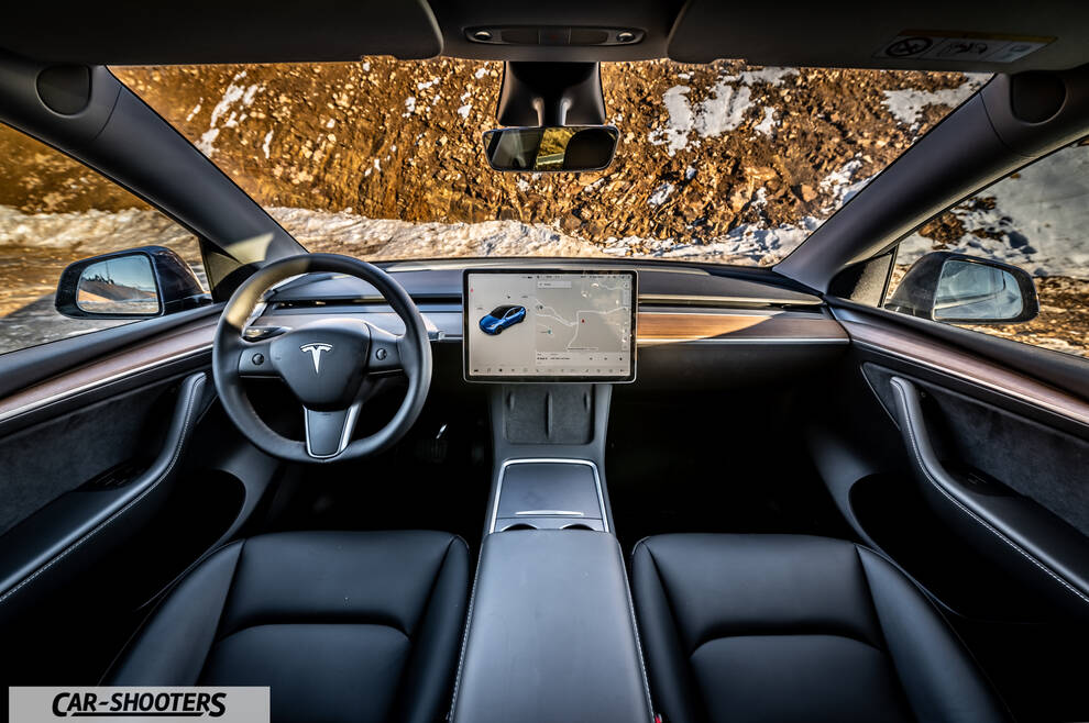 Tesla Model Y – dashboard, against a snowy mountain backdrop