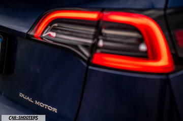 Tesla Model Y – detail, taillight and dual motor badge close-up