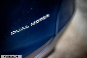 Tesla Model Y – detail, dual motor badge close-up