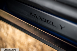 Tesla Model Y – detail, door sill plate close-up