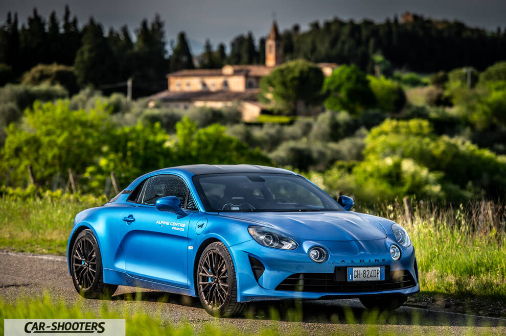 Alpine A110 – front three-quarter, blue on a country road