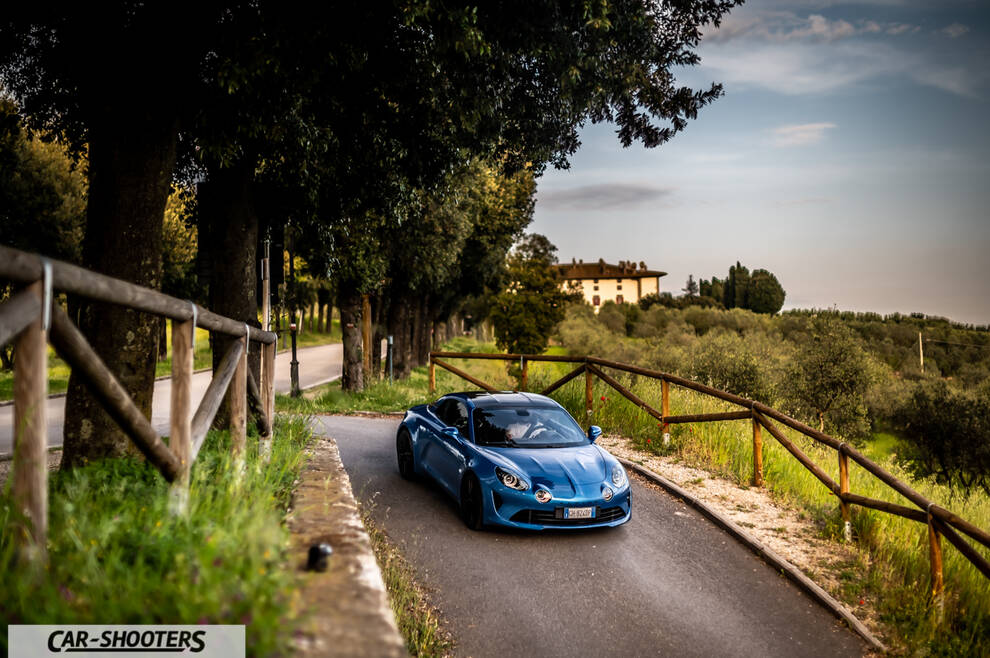 Alpine A110 – front three-quarter, blue on a country road