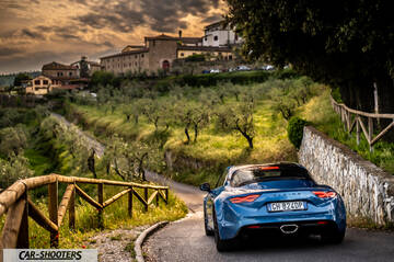 Alpine A110 – rear three-quarter, blue on a country road