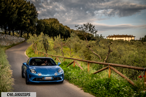Alpine A110 – front three-quarter, blue on a country road
