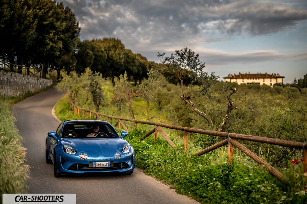Alpine A110 – front three-quarter, blue on a country road