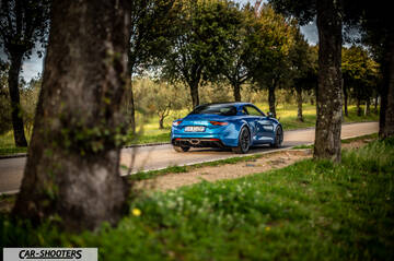 Alpine A110 – rear three-quarter, blue on a country road