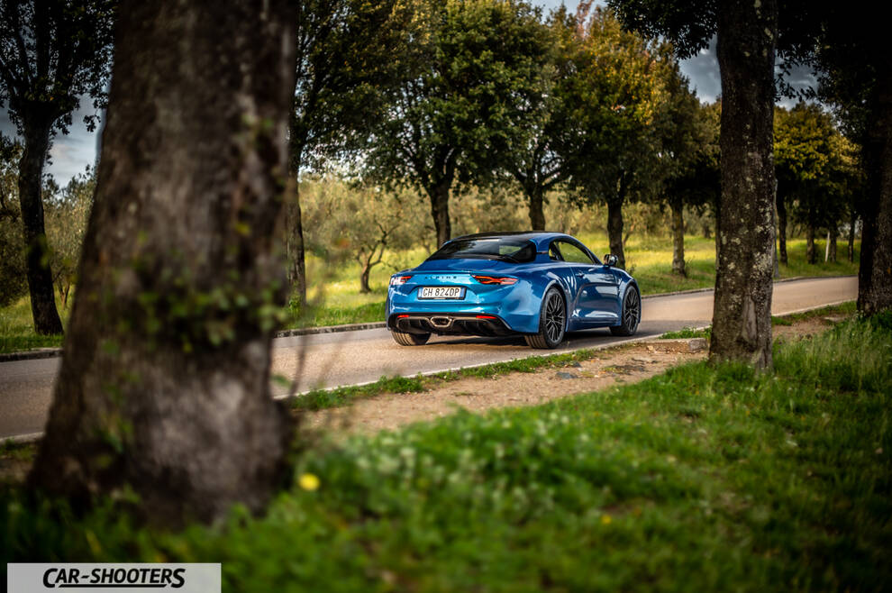 Alpine A110 – rear three-quarter, blue on a country road