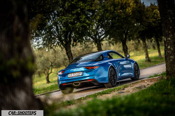 Alpine A110 – rear three-quarter, blue on a country road