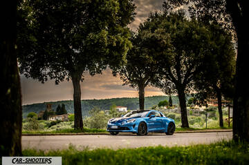 Alpine A110 – side profile, blue on a country road