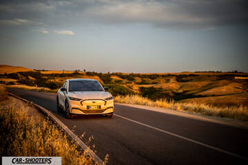Ford Mustang Mach E – front three-quarter, white on a country road