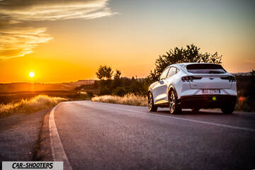 Ford Mustang Mach E – rear three-quarter, white on a country road