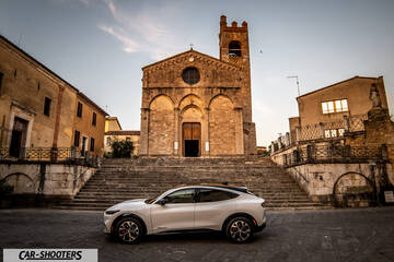 Ford Mustang Mach E – side profile, white in an old town square