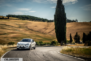 Ford Mustang Mach E – front three-quarter, white on a country road