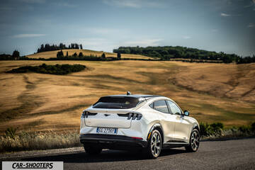 Ford Mustang Mach E – rear three-quarter, white on a country road