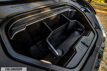 Ford Mustang Mach E – engine bay, black plastic storage compartment