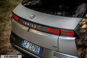 Hyundai Ioniq 5 – rear view, silver matte outdoors near trees