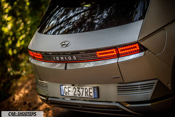 Hyundai Ioniq 5 – rear view, matte grey against a leafy background