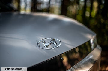Hyundai Ioniq 5 – detail, emblem close-up in the woods