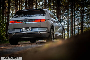Hyundai Ioniq 5 – rear three-quarter, silver in a forest