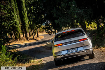Hyundai Ioniq 5 – rear three-quarter, silver on a country road