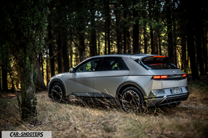 Hyundai Ioniq 5 – rear three-quarter, silver in a forest