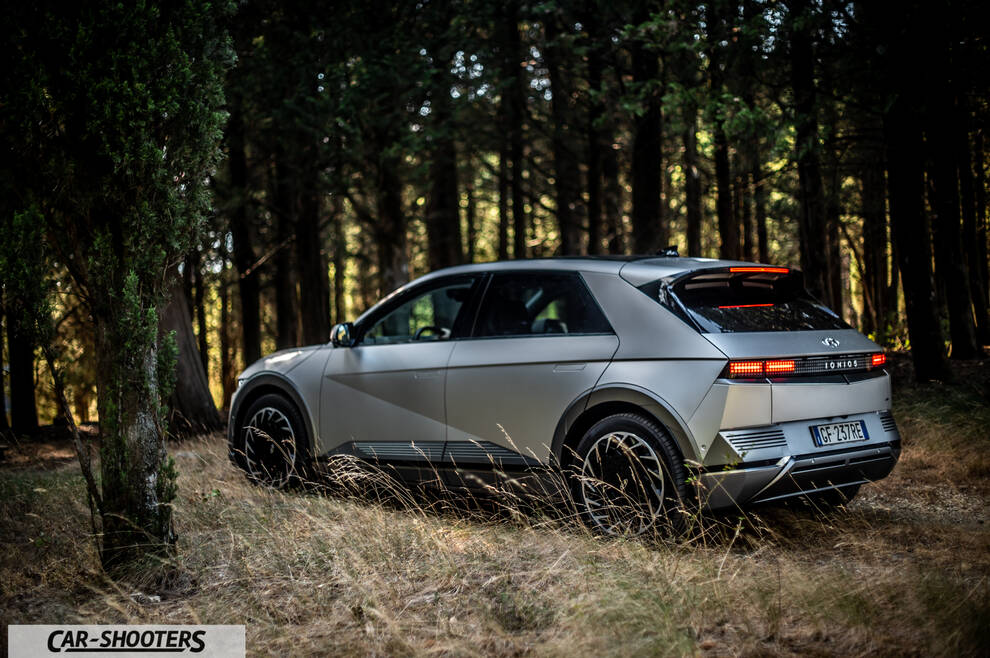 Hyundai Ioniq 5 – rear three-quarter, silver in a forest