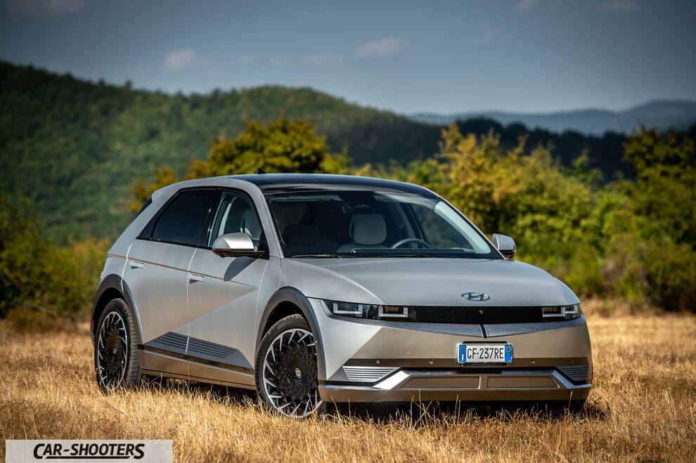 Hyundai Ioniq 5 – front three-quarter, silver against a mountain backdrop