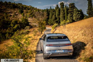 Hyundai Ioniq 5 – rear view, silver on a narrow country road
