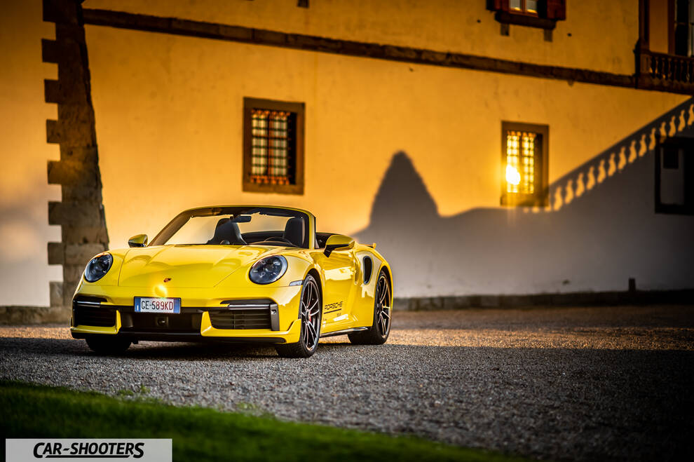 Porsche 911 Turbo Cabrio – front three-quarter, yellow against a yellow wall
