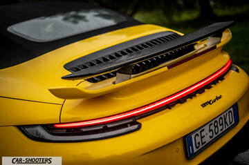 Porsche 911 Turbo Cabrio – rear view, yellow with a large rear spoiler
