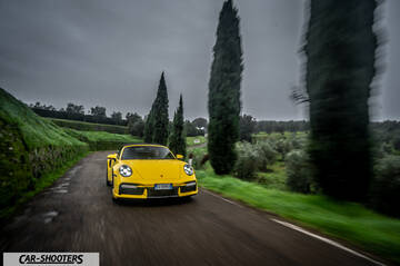 Porsche 911 Turbo Cabrio – front three-quarter, yellow on a country road