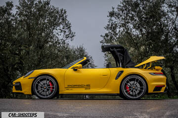 Porsche 911 Turbo Cabrio – side profile, yellow on a country road