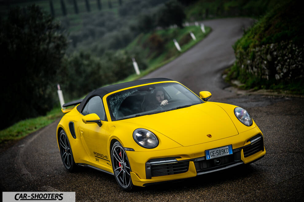Porsche 911 Turbo Cabrio – front three-quarter, yellow on a country road