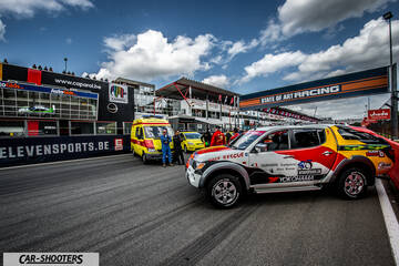 front three-quarter, white at a racetrack pit lane