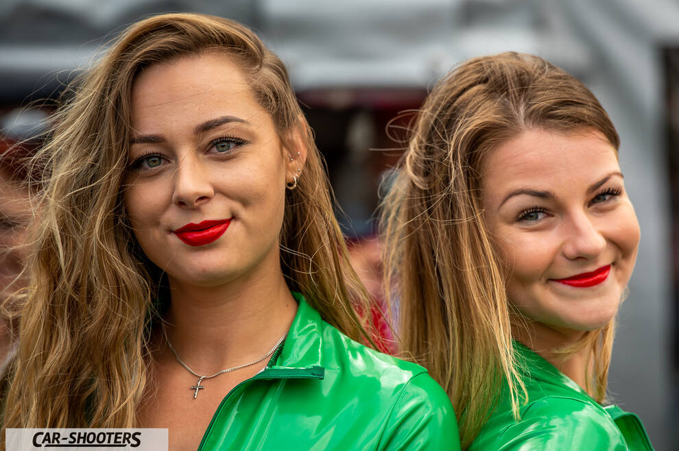 detail, two models with green outfits