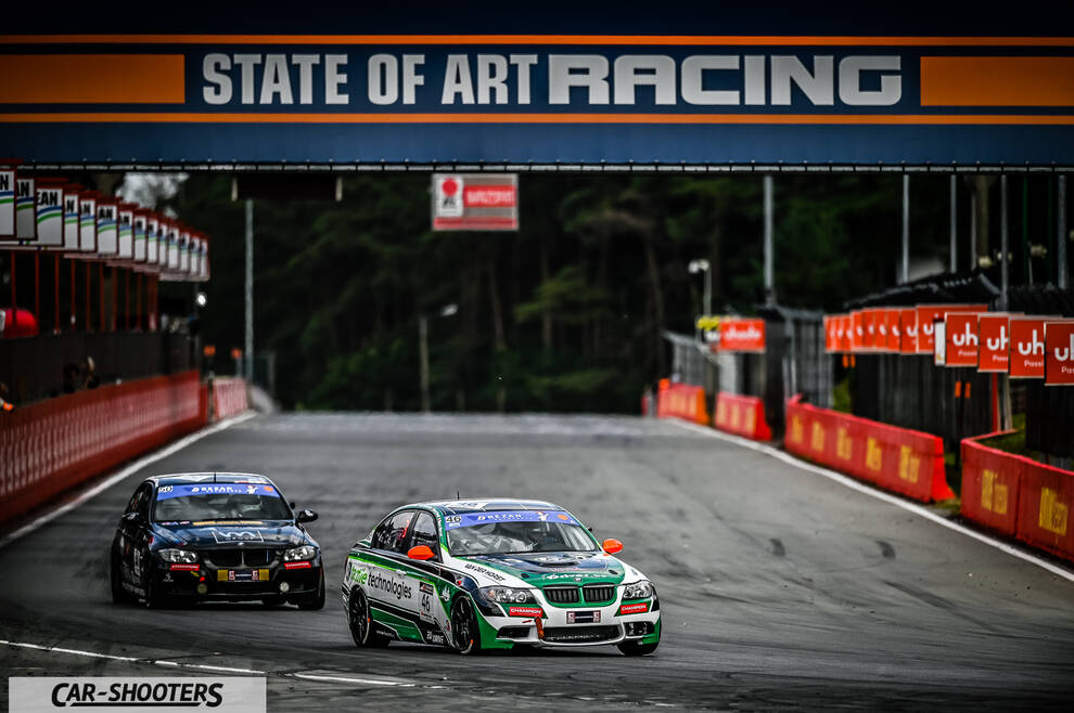 front three-quarter, white on a race track