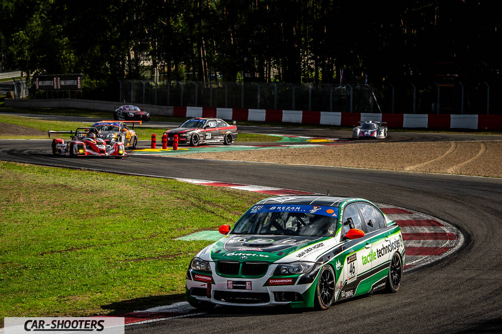 front three-quarter, white and green on a race track