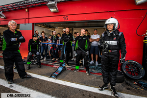 detail, race team in pit garage