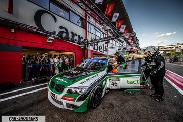 front three-quarter, white with green and black in pit lane during a race